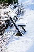 Snow covered chair 