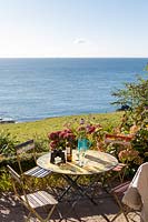 Outdoor garden table and chairs with fabulous view of the sea at Prawle Point, East Prawle, Devon