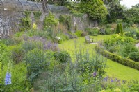 View over flowerbed in The Upper Walled Garden - Designer: Penelope Hobhouse - June