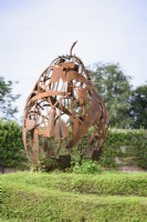 A pear constructed from rusty old implements at Gordon Castle Walled Garden, Scotland