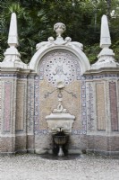 Fountain of Abundance, Sintra, near Lisbon, Portugal, September.  Ornate mosaic and stone Dolphin fountain with shell detail and obelisk.