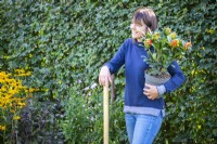 Woman talking while gardening