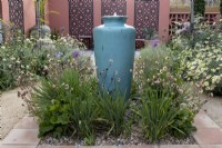 Mediterranean style garden with tall ceramic container water feature