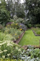 Walled garden, raised beds with surrounding lawn pathways
