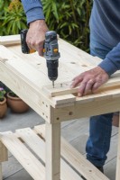Step-by-Step Making a Potting Bench. Step 11: attach uprights to top rail
