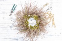 Twig wreath lying on table