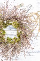 Twig wreath lying on table