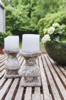 Rustic candles on the wooden table