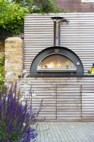 Bespoke kitchen unit with integrated  pizza oven and storage.