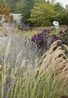 Flowering perennials with Barbara Hepworth sculpture  Turning Forms 