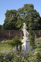 Profile of Flora statue - Goddess of Spring - in the Rose Garden at Hampton Court Palace - East Molesey, Surrey, UK