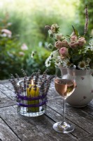 Lavender candle holder, glass of wine and bouquet of summer flowers on garden table - Step by step How to make a lavender candle holder