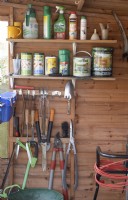 Interior of a well organised garden shed with various tools. Spring