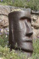 Easter Island style sculptural heads are planted with sempervivums, for year round interest. Spring