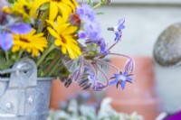 Bouquet containing Rudbeckia fulgida 'Goldsturm', Ageratum 'Blue Mink', Borage blue, Calendula 'Art Shades' and Nigella hispanica