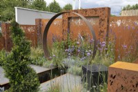 Corten steel moongate in the Sunburst garden at RHS Hampton Court Palace Garden Festival 2022