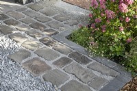 Hard landscaping examples - paving stones, gravel, edging stones, and bark
