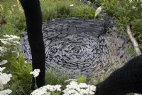 Circular slate dip in the Connections garden at RHS Hampton Court Palace Garden Festival 2022