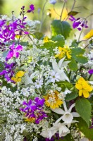 Flower bouquet containing daffodils  and wild flowers such as cow parsley, greater stitchwort and honesty.