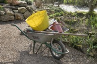 Wheelbarrow piled high with tools at Birmingham Botanical Gardens and Glasshouses