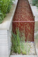 Morris  and  Co. Garden. Designer: Ruth Willmott. RHS Chelsea Flower Show 2022. Gold Medal. Water rill with William Morris 'Willow Boughs' laser cut design in metal.