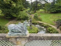 Indian bridge with Brahmin bulls and water garden at Sezincote gardens Moreton-in-Marsh Gloucestershire