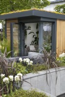 Wooden home office in the Nurture Through Nature Garden at BBC Gardener's World Live 2022