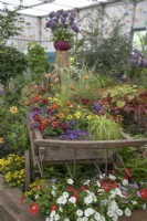 Old wooden carriage planted with summer bedding plants at BBC Gardener's World Live 2022