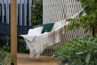 Black and white woven hammock with woven screen behind - The Calm of Bangkok, RHS Chelsea Flower Show 2021