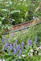 Copper water rill winding through planting - Finding Our Way: An NHS Tribute Garden, RHS Chelsea Flower Show 2021