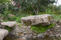 Natural stone boulders next to a pool - Bible Society: The Psalm 23 Garden, RHS Chelsea Flower Show 2021