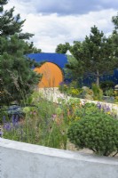 Colourful planting in Over The Wall Garden, supported by Takeda. RHS Hampton Court Palace Garden Festival 2022