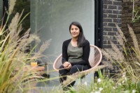Meera, the owner relaxing in the garden. 