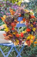 Autumn wreath made of dried hydrangea, Chinese lantern and Boston ivy leaves.