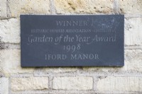 Slate plaque on wall commemorating winning of Historic Houses Association Garden of The Year in 1998