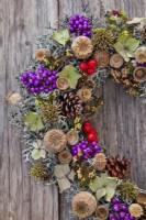 Wreath made from cones, poppy seedheads, rowan and Callicarpa berries, lichens and acorns.