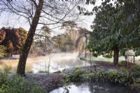 The Wells Garden at The Bishop's Palace Garden in January with bubbling springs in the foreground.