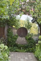 Circular round steel garden sculpture.