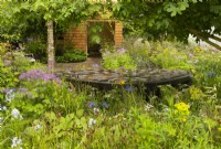 Horatio's Garden, a show garden designed by Charlotte Harris and Hugo Bugg featuring a woodland retreat, water feature, herbaceous planting  shade trees and accessible areas for people affected by spinal injuries.  