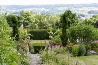 Milton Lodge Gardens, Somerset in June with lush borders and yew hedges