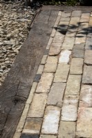 Paving made from reclaimed brick slips edged with railway crossrails - The 3D Gardener Path of Renewal - BBC Gardeners' World Live 2023, NEC Birmingham - Designer David Negus