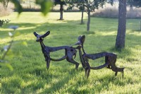 Helen Denerley deer sculptures among trees