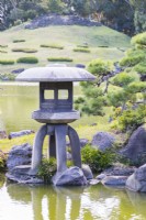 Four footed stone lantern at the edge of the lake