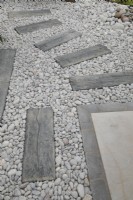 Old sleepers set in gravel in 'The Sea Garden' at BBC Gardener's World Live 2021, august 