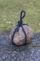 Stone tied in twine called a Tome Ishi indicating 