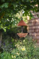 Bird feeder in Horatio's Garden, Designer: Charlotte Harris and Hugo Bugg, Gold medal winner, Best Show Garden, Chelsea Flower Show 2023 