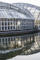 The Conservatory reflected in the adjacent pool. 