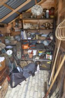 Wooden shed full of tools 