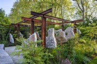 Suspended concrete panels in Samaritans' Listening Garden, RHS Chelsea Flower Show 2023, Designer Darren Hawkes 