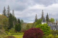 The turret and chimneys of Attadale House, Acer griseum and a view to Lochcarron from the viewing point.